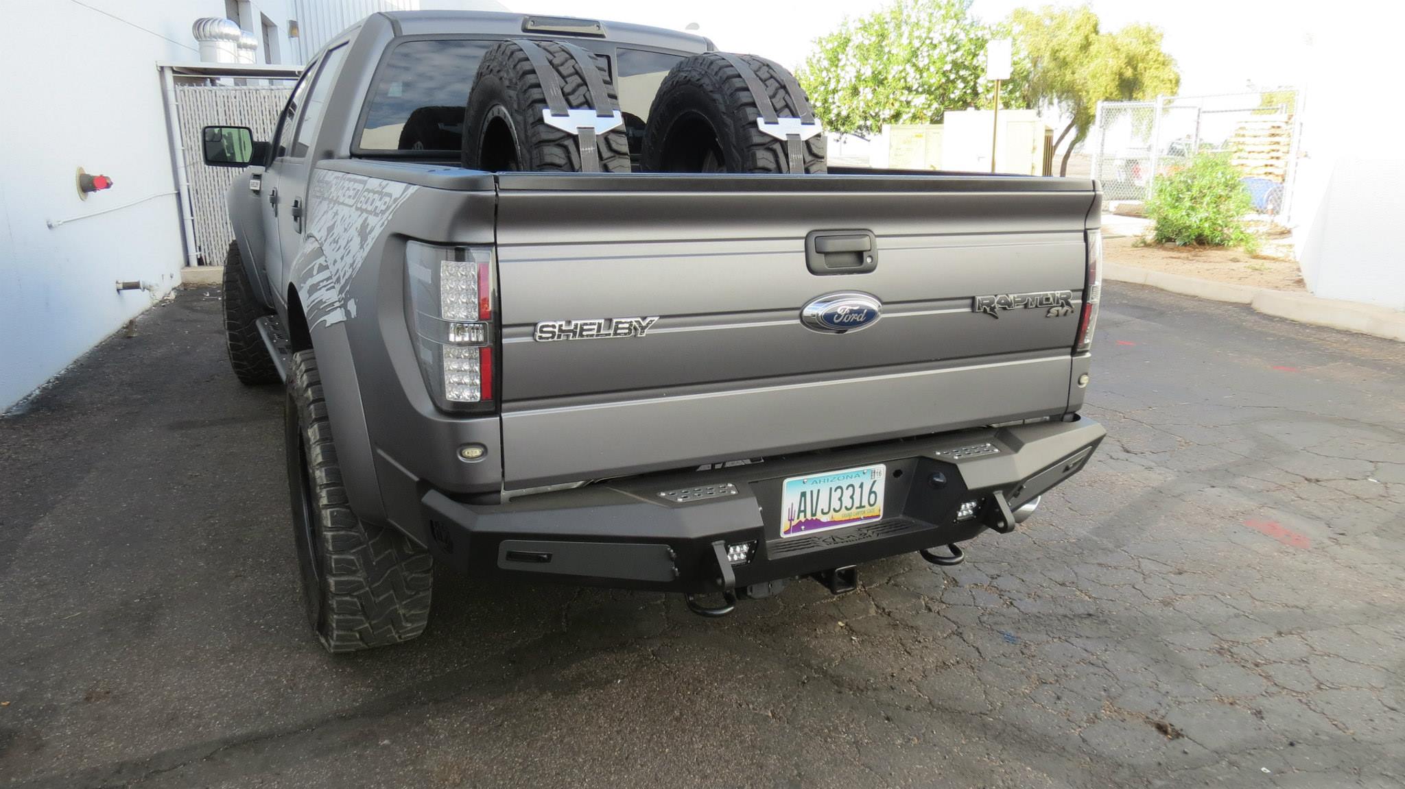 Addictive Desert Designs 10-14 Ford F-150 Raptor HoneyBadger Rear Bumper w/ Tow Hooks - 0