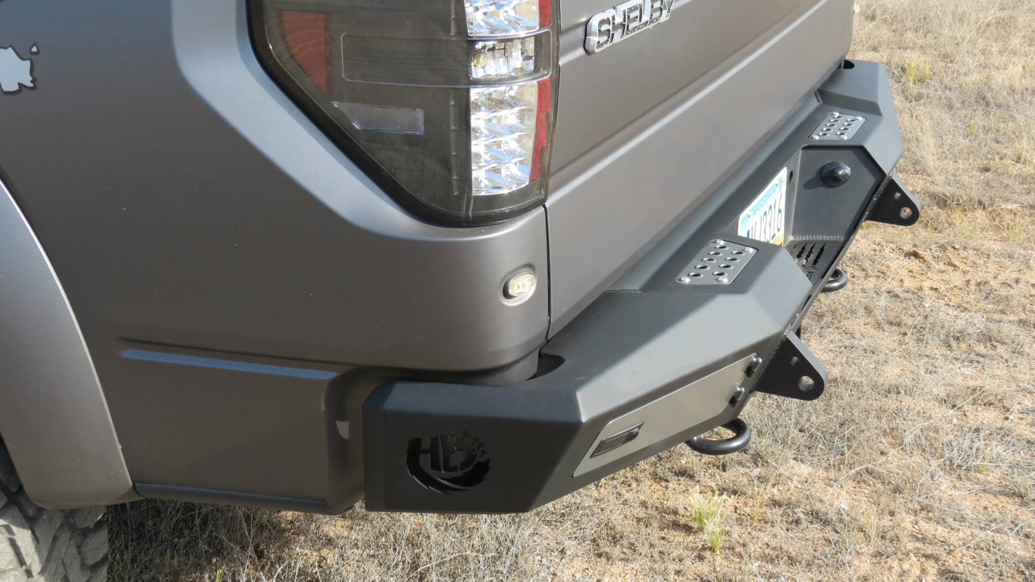 Addictive Desert Designs 10-14 Ford F-150 Raptor HoneyBadger Rear Bumper w/ Tow Hooks