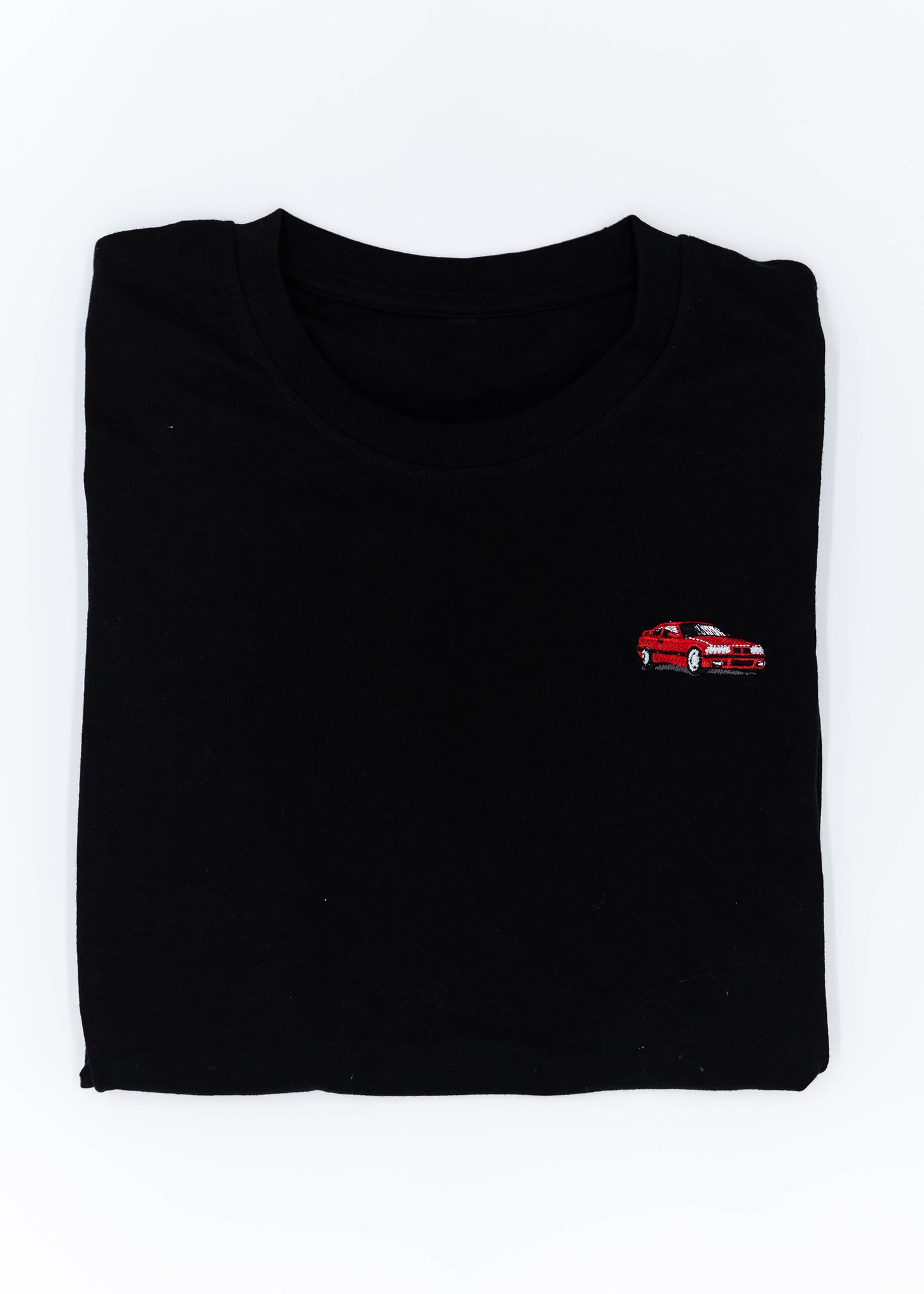 A black E36 M3 T-Shirt for men. Photo is a front view of the shirt with an embroidered red E36 M3. Fabric composition is 65% polyester, and 35% cotton. The material is very stretchy, soft, comfortable, breathable, and non-transparent. The style of this shirt is short sleeve, with a crewneck neckline.